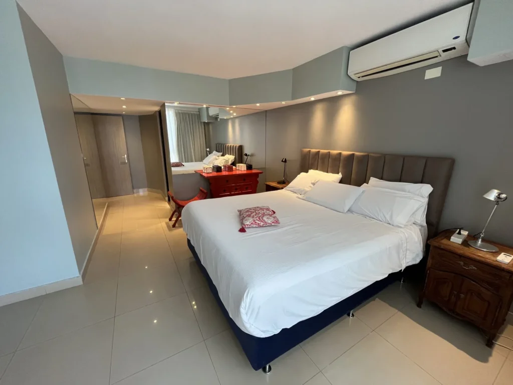 Shoshana Suite bedroom with bed and upholstered headboard